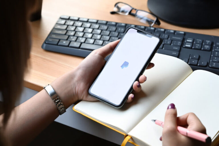 Woman using Paypal app on a smartphone