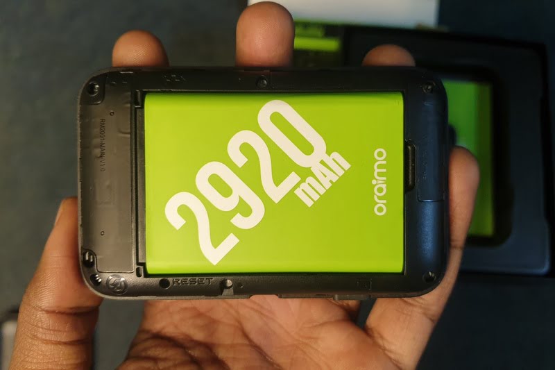 Man holding oraimo mifi router