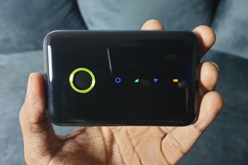 Man holding oraimo mifi router