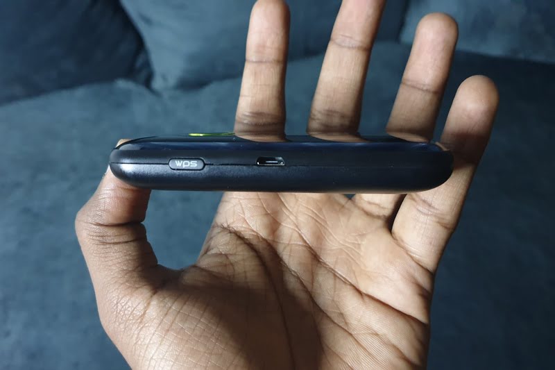 Man holding oraimo mifi router