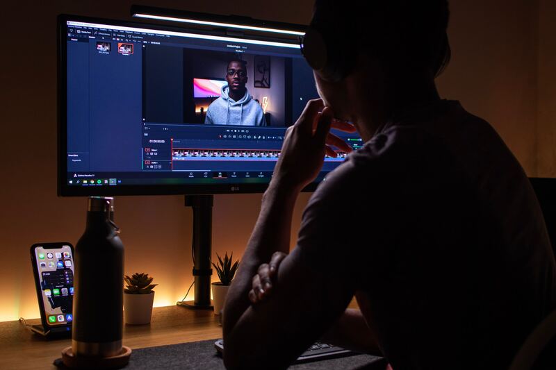 Man editing a video on a computer