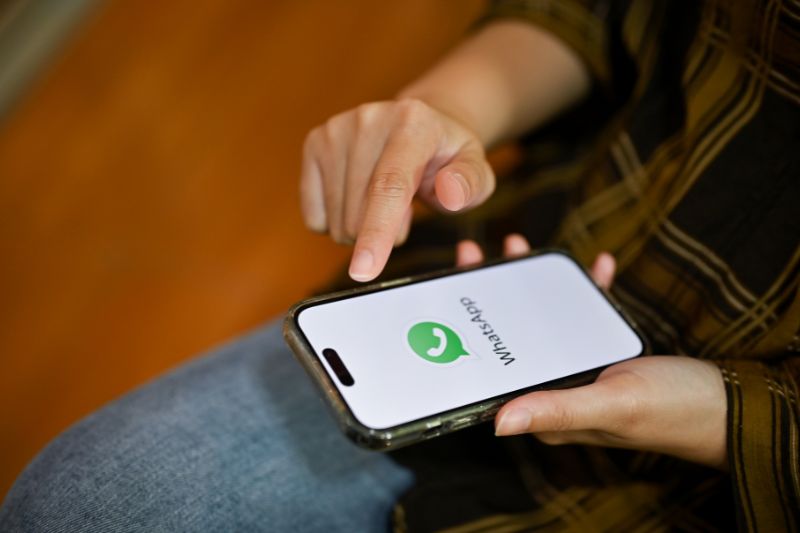 Man using WhatsApp on phone