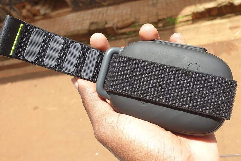 Man holding a portable Bluetooth speaker