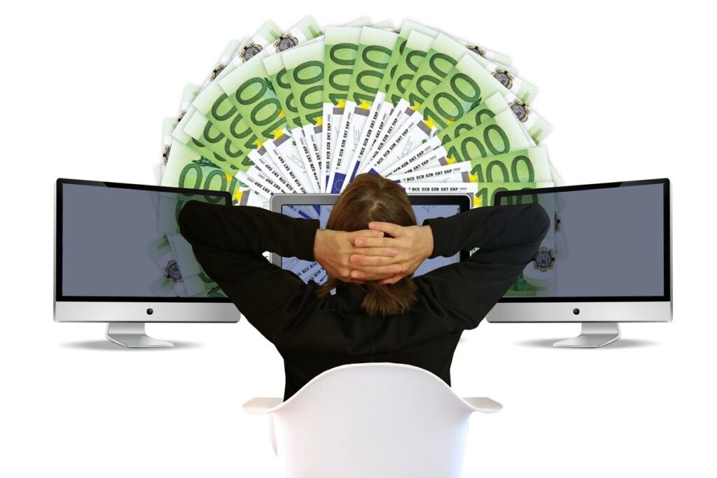 Illustration of desktop and man looking at money