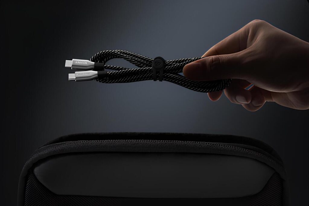 person holding a charging cable