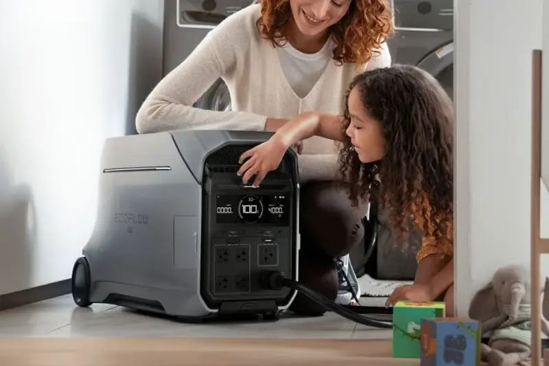 Woman and child interacting with a power station